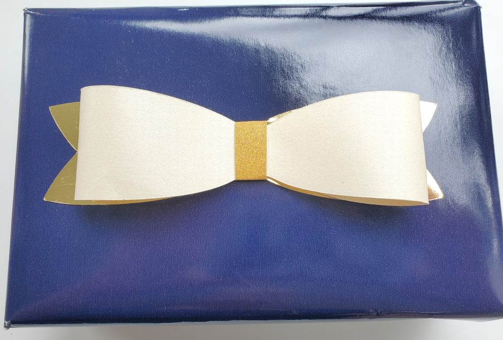 Solid colour wrapping with paper bow tie.
